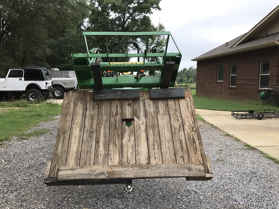 John Deere 4044M Pallet Forks with Custom Slide Off Work Stand Front View