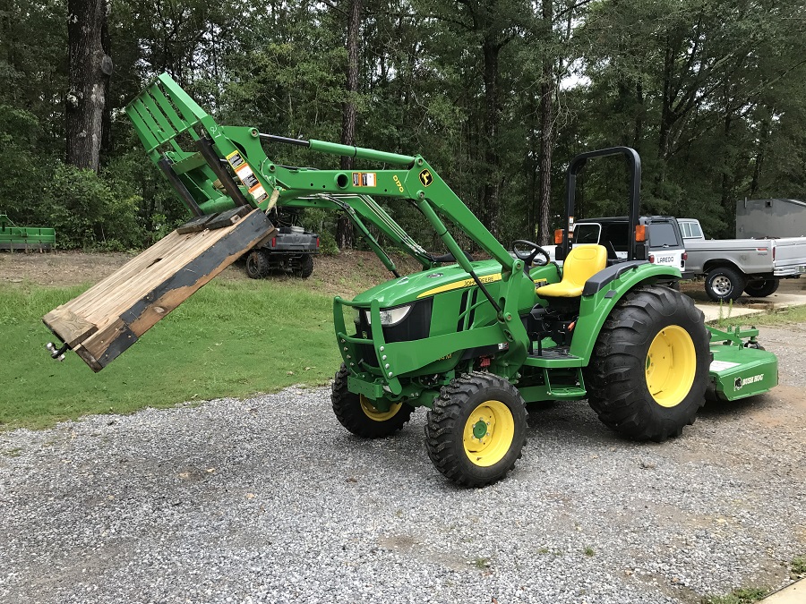 John Deere 4044M Pallet Forks with Custom Slide Off Work Stand Left Side