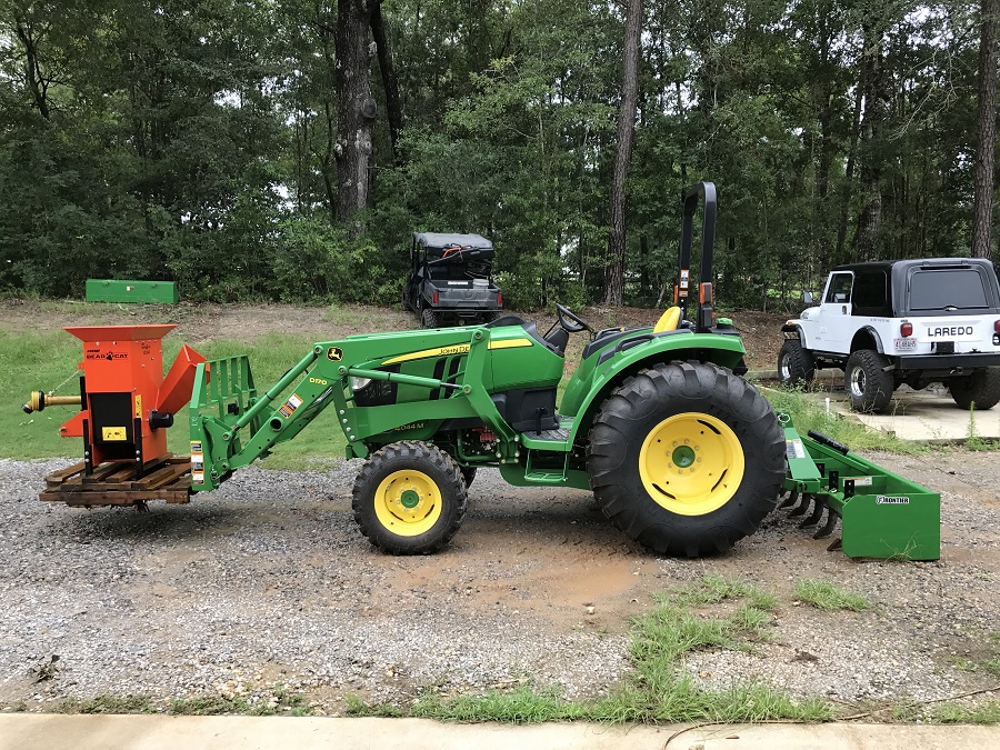 John Deere 4044M Tractor with Frontier Box Blade Left Side